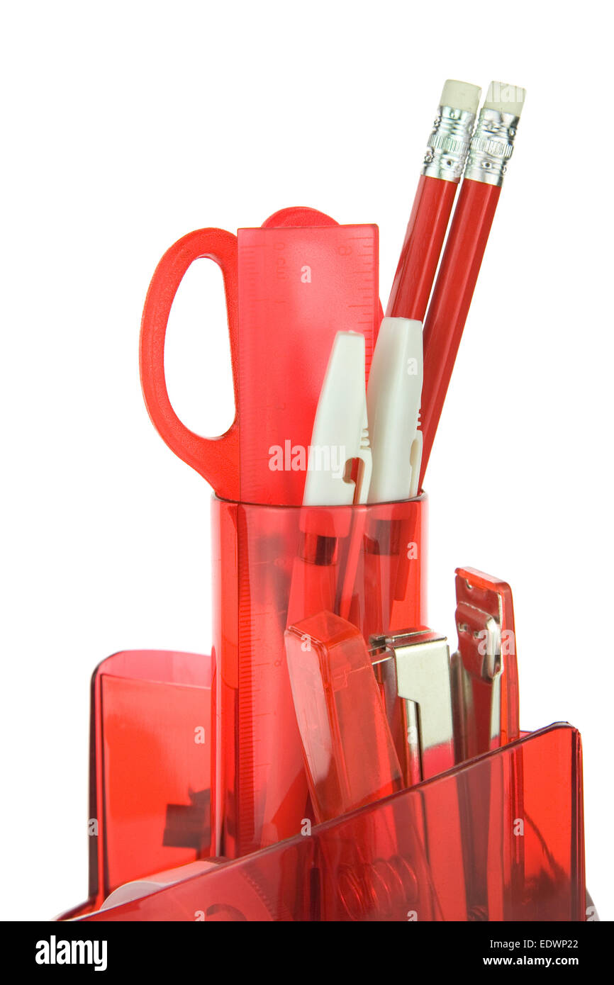 front view of a red desk stationery organiser full of Stationery Stock Photo
