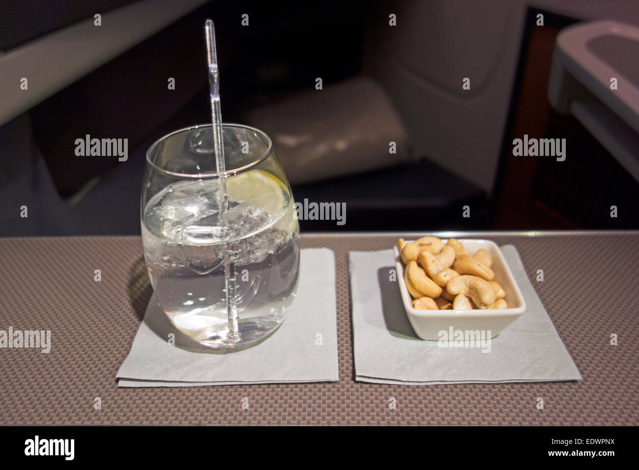 Refreshing cocktail and hot nuts Stock Photo