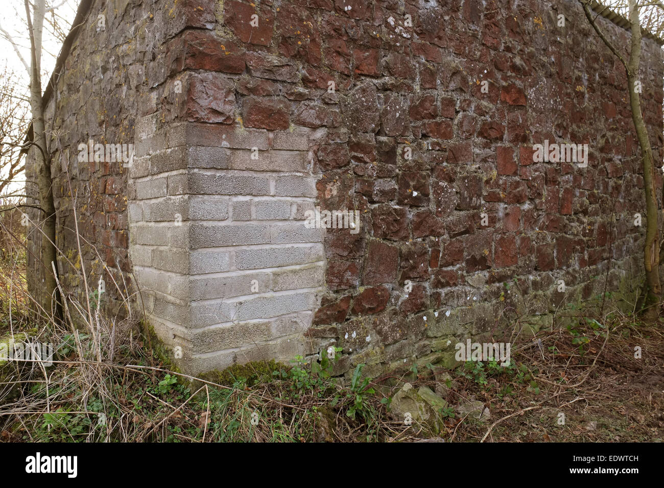 Corner of an old stone barn repaired with modern blockwork, 10th January 2015 Stock Photo