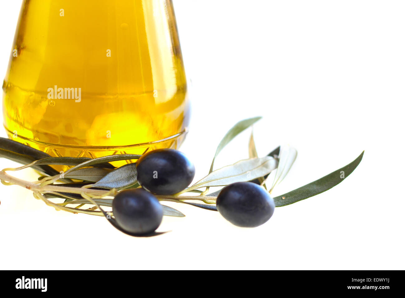 Bottle of olive oil and black olives isolated on white background Stock Photo