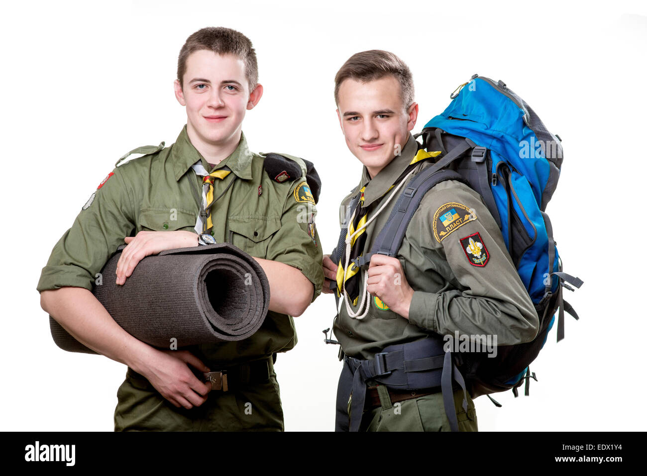 Two young scout boys with sleeping bag and backpack isolated on white background Stock Photo Alamy