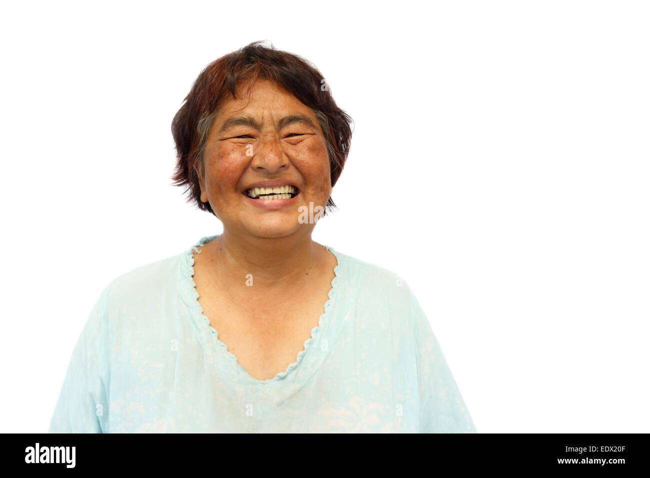 Old aged thai woman is smiling and blank area at right side Stock Photo