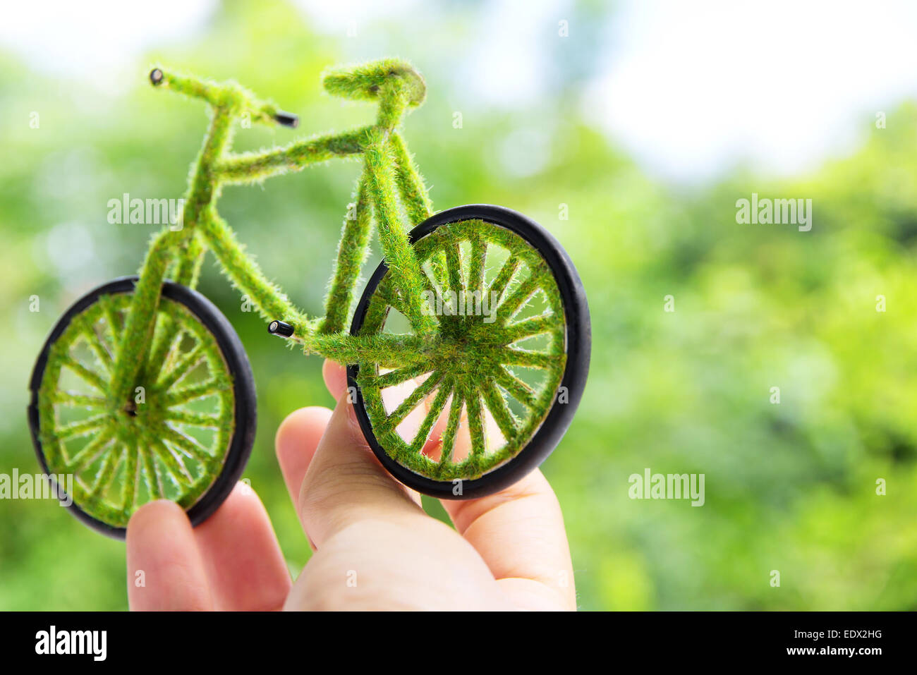 Hand Holding handcraft green bicycle Stock Photo Alamy