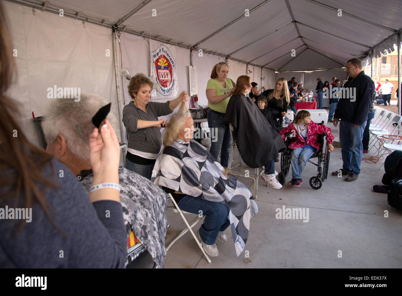 Tucson, Arizona, USA. Jan. 10, 2015. Homeless U.S. military veterans receive medical care, clothing and grooming at the 16th biannual Stand Down event hosted by Tucson Veterans Serving Veterans.  The U.S. Department of Housing and Urban Development estimated in January of 2014 that 49,933 American military veterans are homeless. Credit:  Norma Jean Gargasz/Alamy Live News Stock Photo