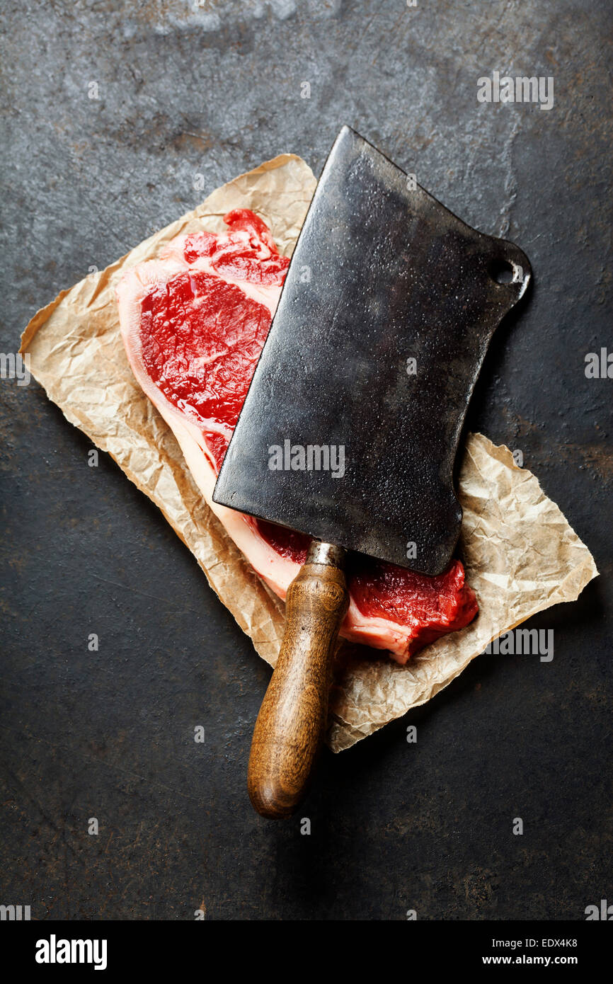 vintage cleaver and raw beef steak on dark background Stock Photo Alamy