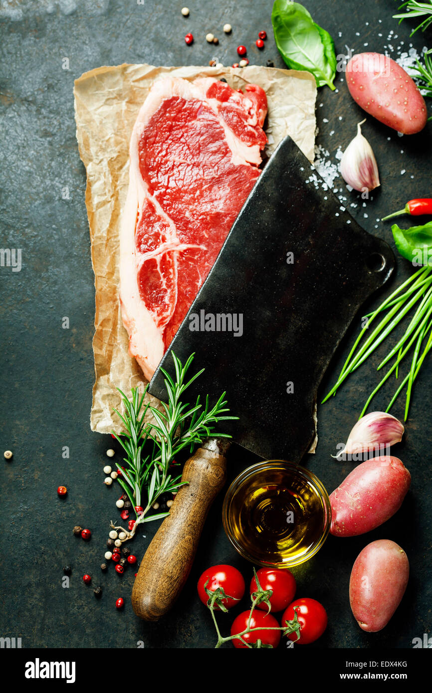 vintage cleaver and raw beef steak on dark background Stock Photo Alamy