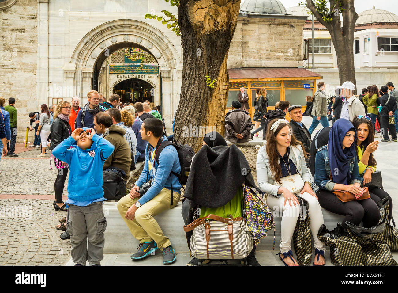 Groups of shoppers at the entrance to the Grand Bazaar in Sultanahmet, Istanbul, Turkey, Eurasia. Stock Photo