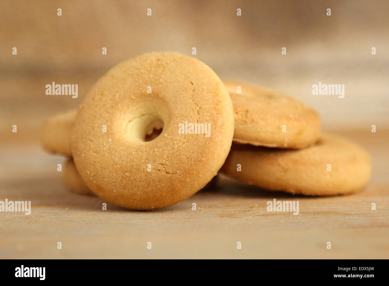 Closeup of a pile of round cookies on a wooden background Stock Photo