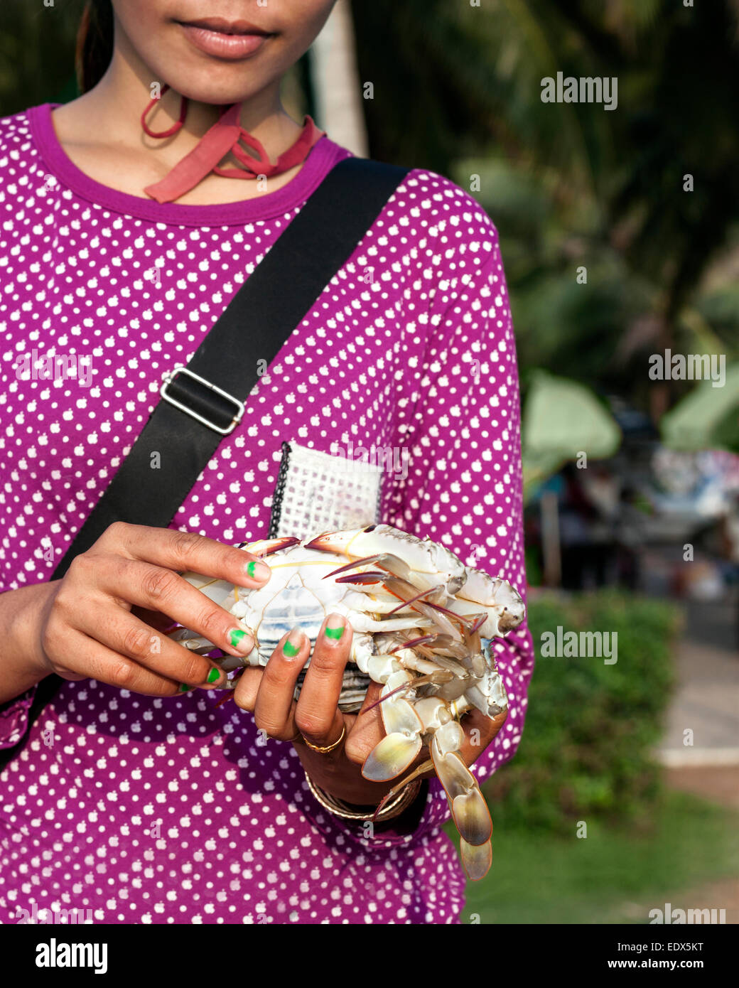 Young woman selling crab at Crab market in Kep, Cambodia. Stock Photo