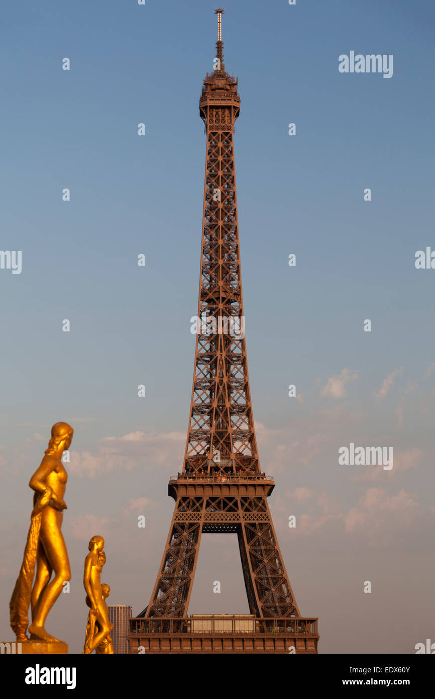 France, Paris, the Eiffel Tower and gold statues. Stock Photo