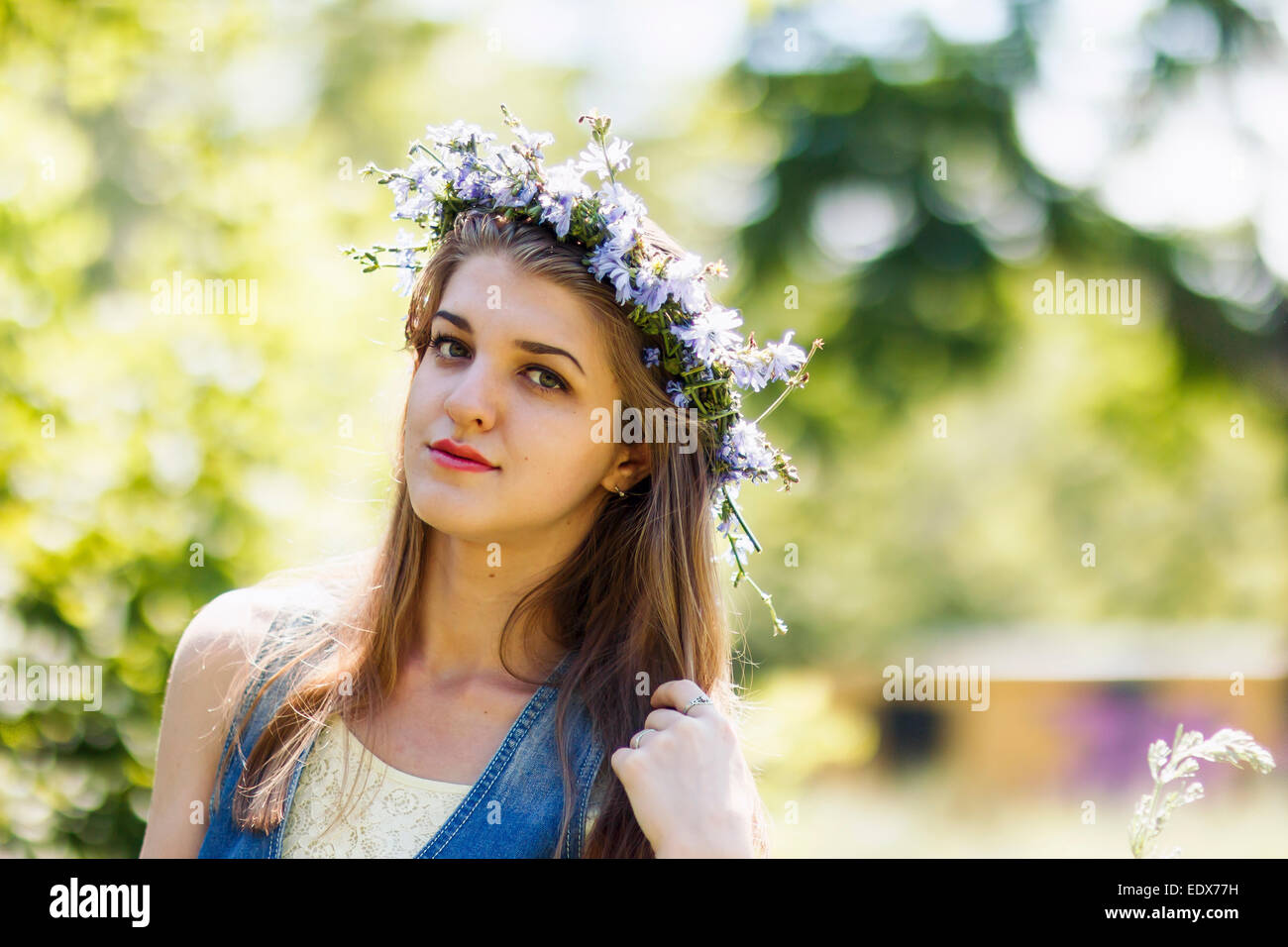 young blond woman with flower wreath on her head Stock Photo - Alamy