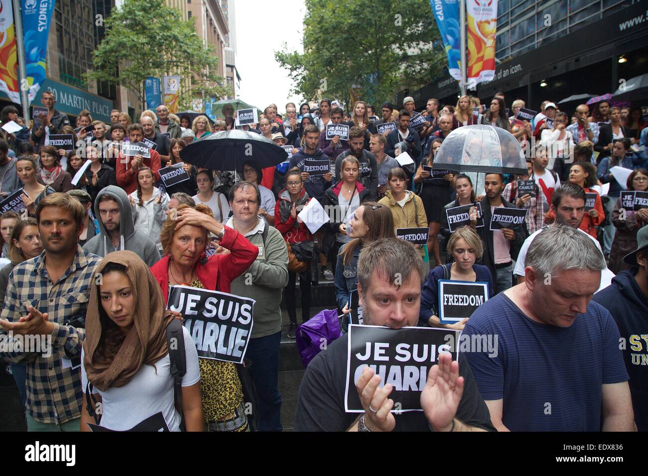 Sydney, Australia. 11 January 2015. French people in Sydney gathered at Martin Place to honour the victims of the Charlie Hebdo attack by Al-Qaeda members. They held signs saying, ‘Freedom’ and ‘Je suis Charlie’. The names of those that had died were read out and a minute’s silence was held. At the end messages were written on a wall. Pictured are people clapping after the minute’s silence. Credit: Copyright Credit:  Richard Milnes/Alamy Live News Stock Photo