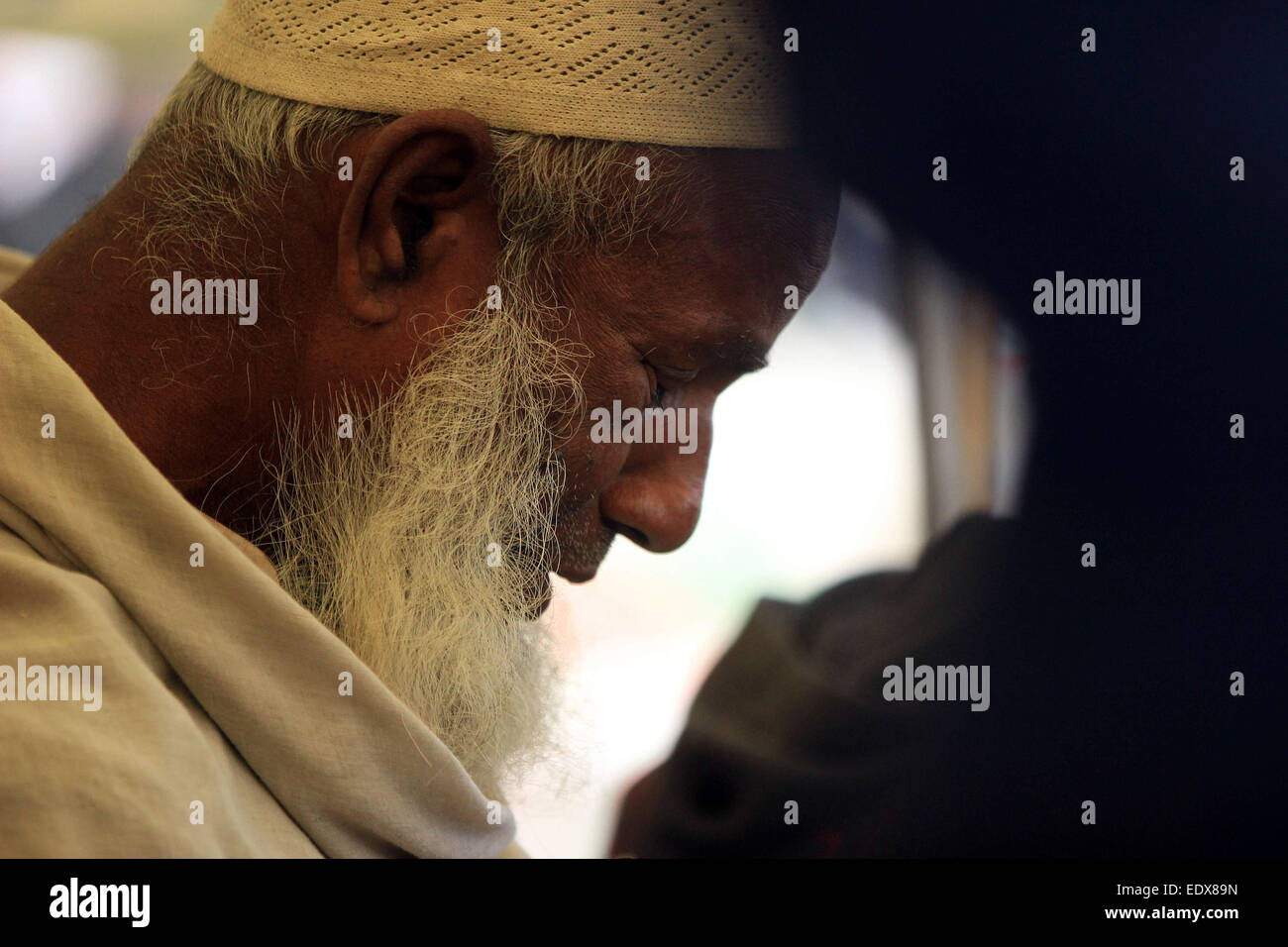 Tongi, Bangladesh. 11th January, 2015. A Bangladeshi Muslim participates in Akheri Munajat, or last prayers, at the conclusion of the Biswa Ijtema or World Muslim Congregation at Tongi, some 30 kms north of Dhaka January 11, 2015. Muslims joined a prayer on the banks of a river in Bangladesh as the world's second largest annual Islamic congregation ended. Stock Photo