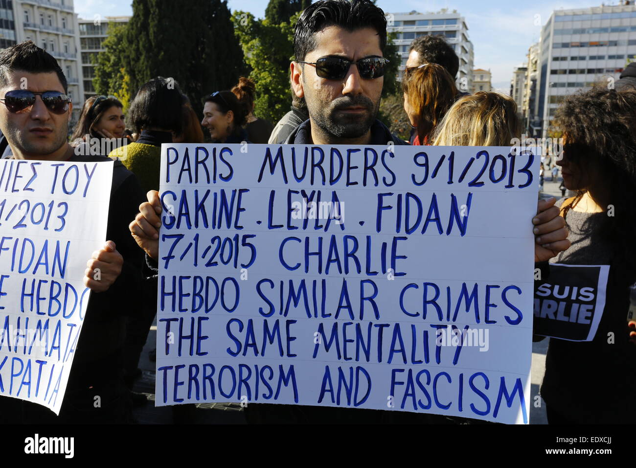 World Event In 2015 Athens, Greece. 11th January 2015. A protester holds a sign, comparing ...