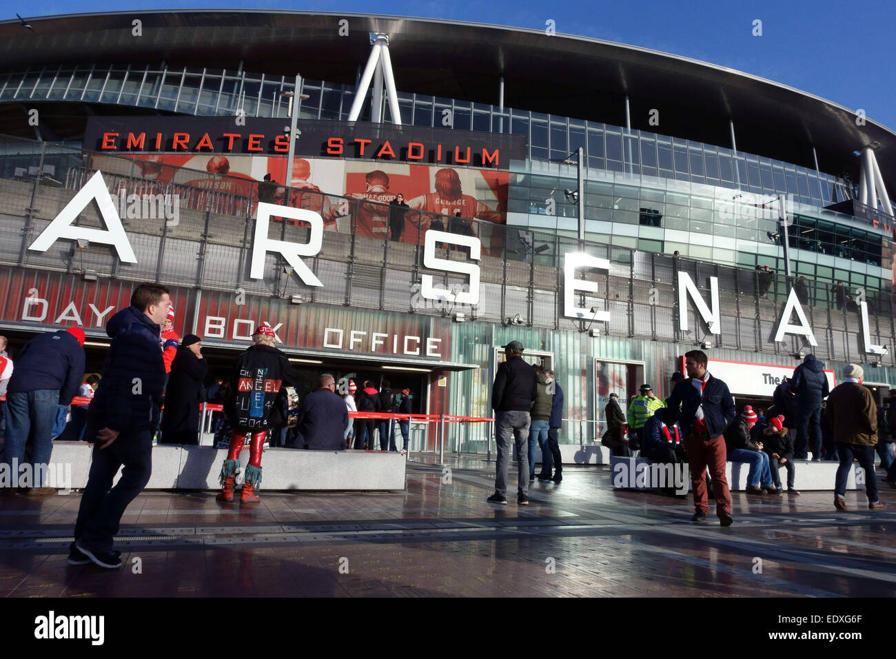 Match day at Arsenal football club Emirates Stadium, London - fans arriving for game against Stoke City Stock Photo