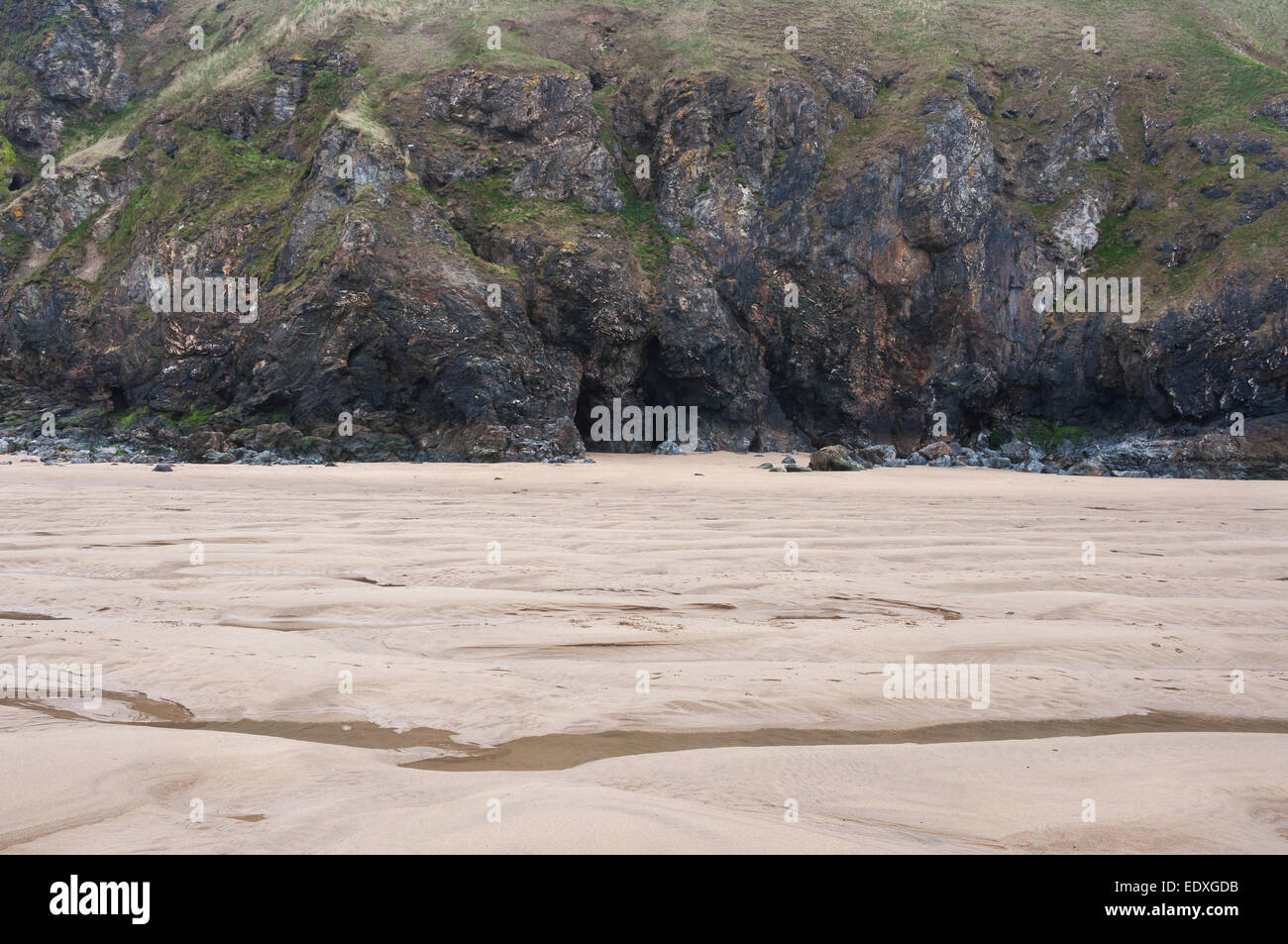 Rocky cliffs at Perranporth beach in North Cornwall. Stock Photo