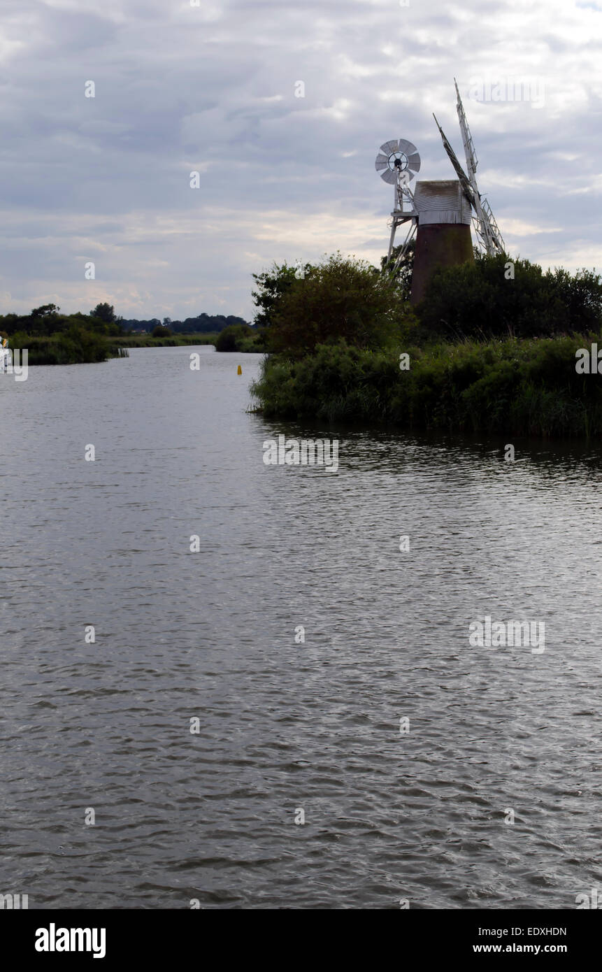 One of the small drainage mills along the banks of the rivers that make up the navigable waterways around the Norfolk Broads Stock Photo