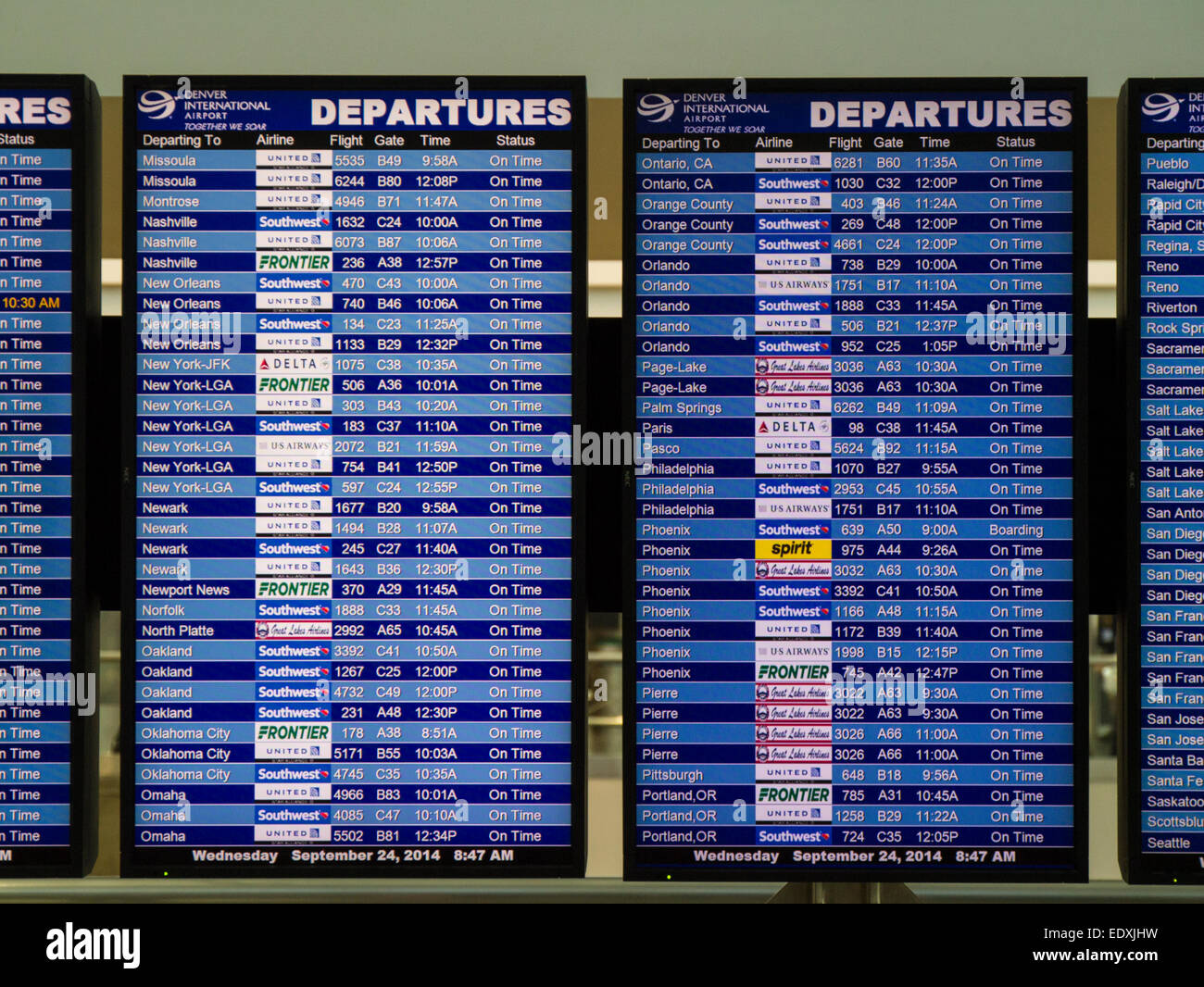 Flight Information Departure Board In Airport Terminal Stock Photo