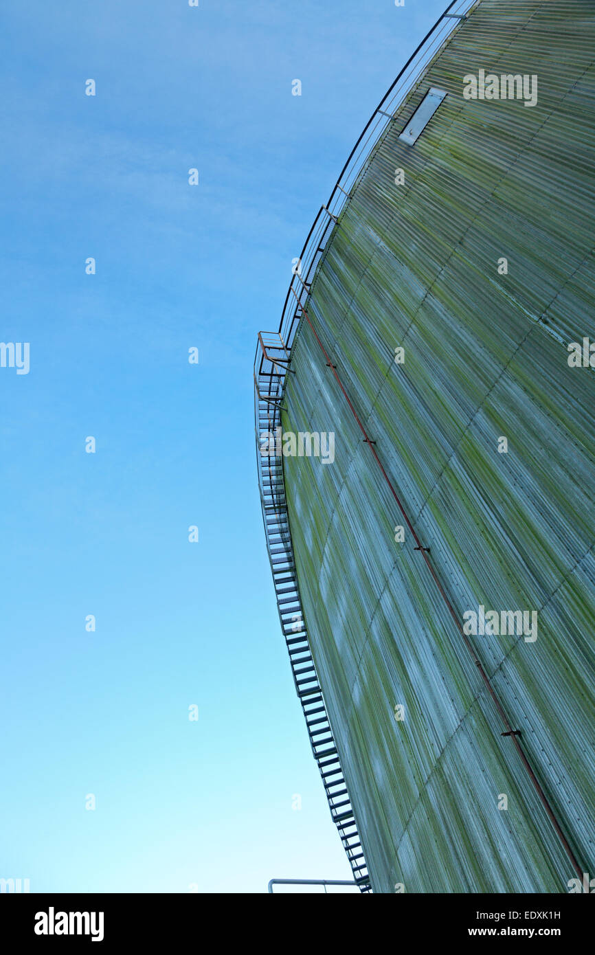 Tainted tanks against blue sky with staircase. Ladder see through. Stock Photo