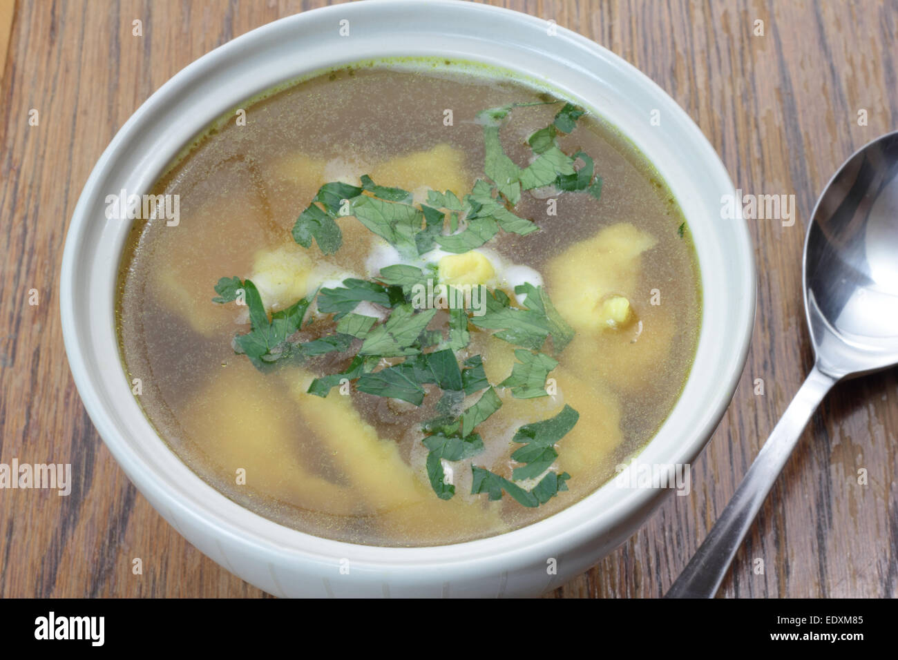 Bowl of chicken broth with noodles Stock Photo Alamy