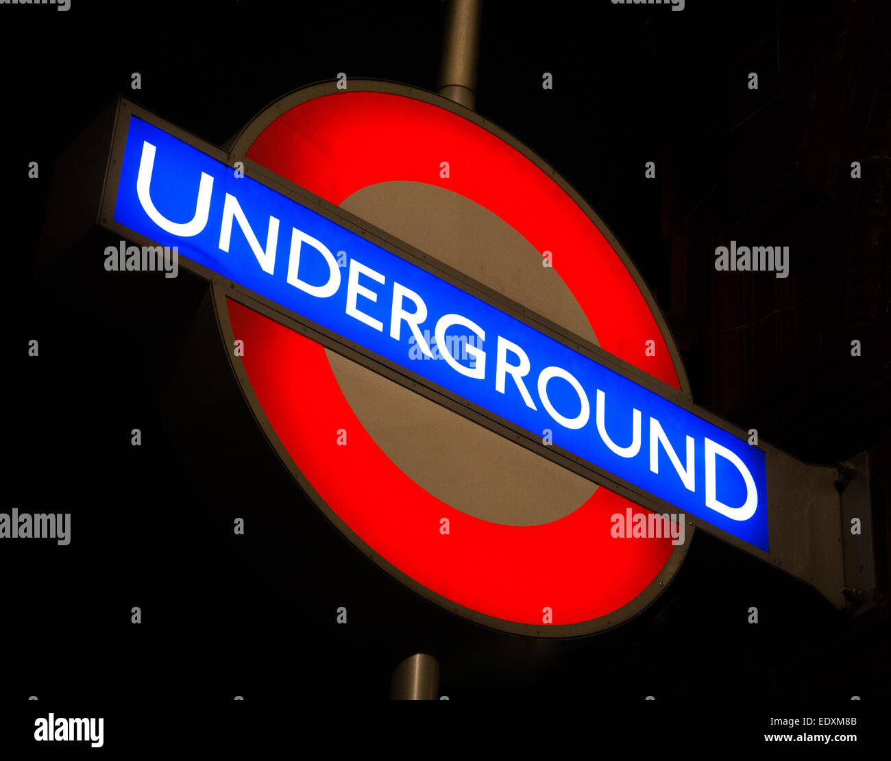 London Underground sign at night Stock Photo - Alamy