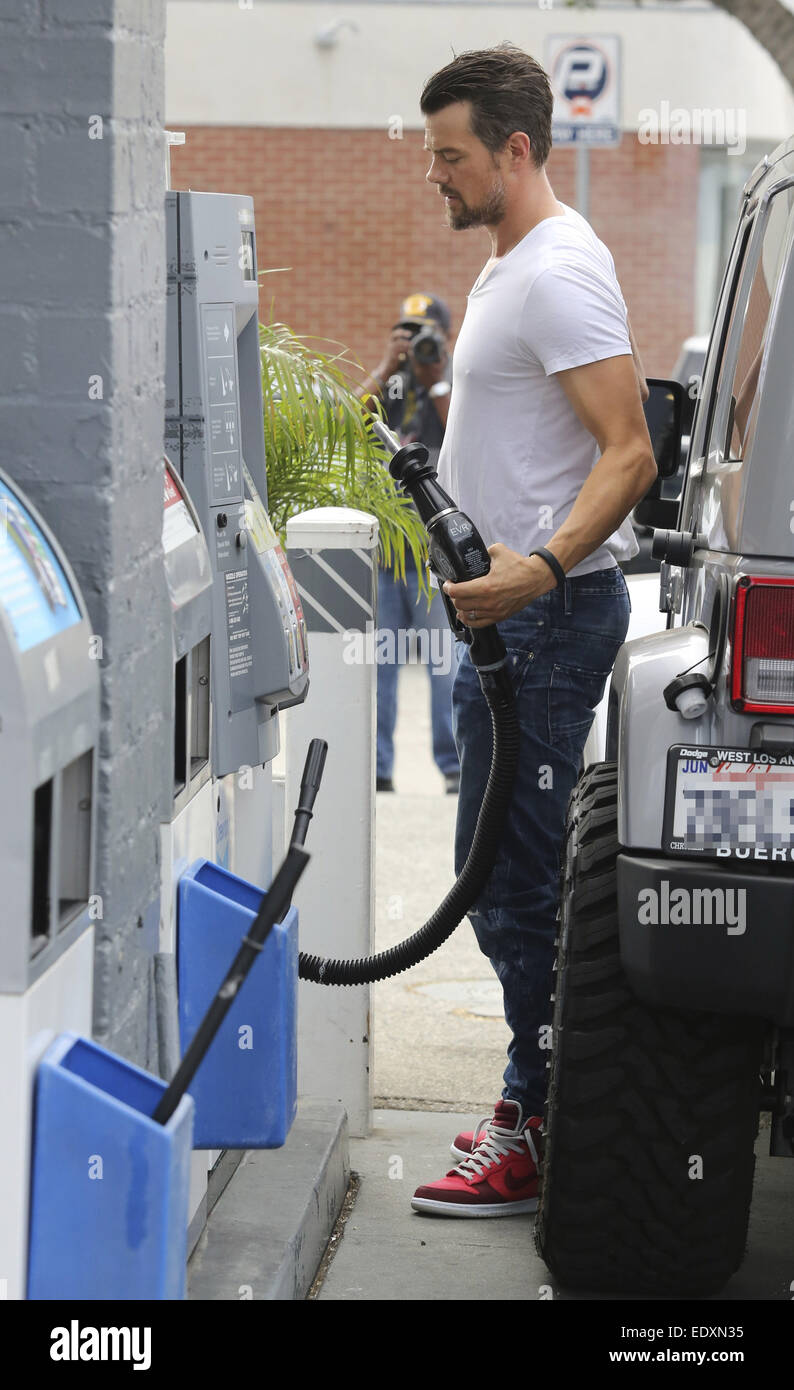 Josh Duhamel pumps his own gas at a station in Brentwood Featuring