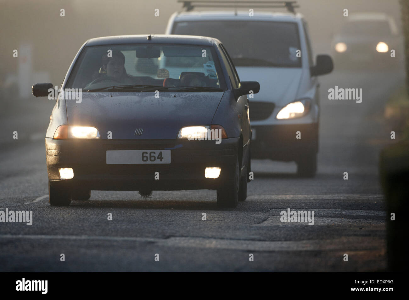 cars driving in the uk on a foggy day Stock Photo