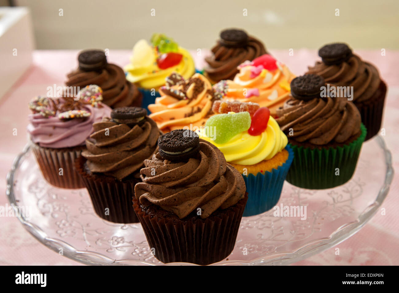 fresh baked cupcakes on a specialty artisan stall at a craft market Stock Photo