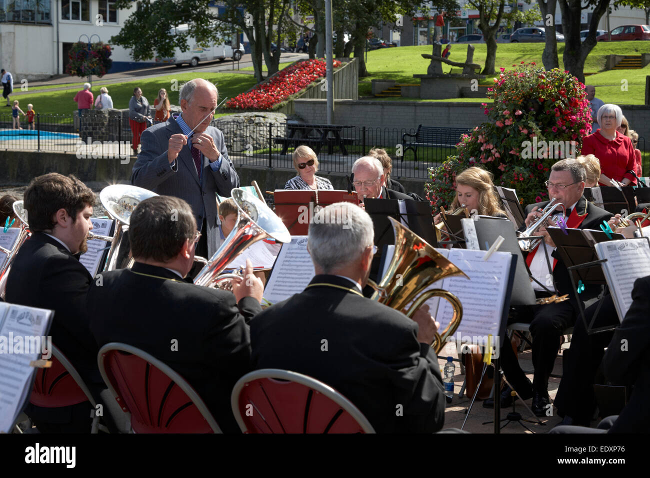 brass band playing outdoors at a summer event in the uk Stock Photo