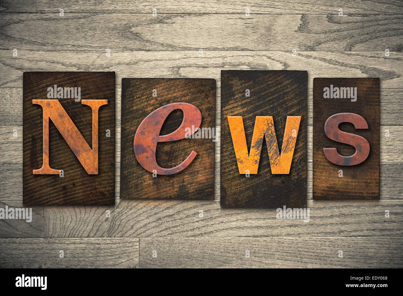 The word 'NEWS' written in wooden letterpress type. Stock Photo