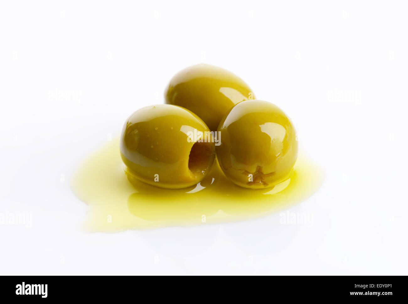 Pitted green olives in oil Stock Photo Alamy