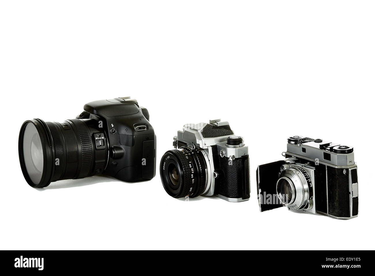Three 35mm cameras representing the changes from the beginning of 35mm to present day Stock Photo