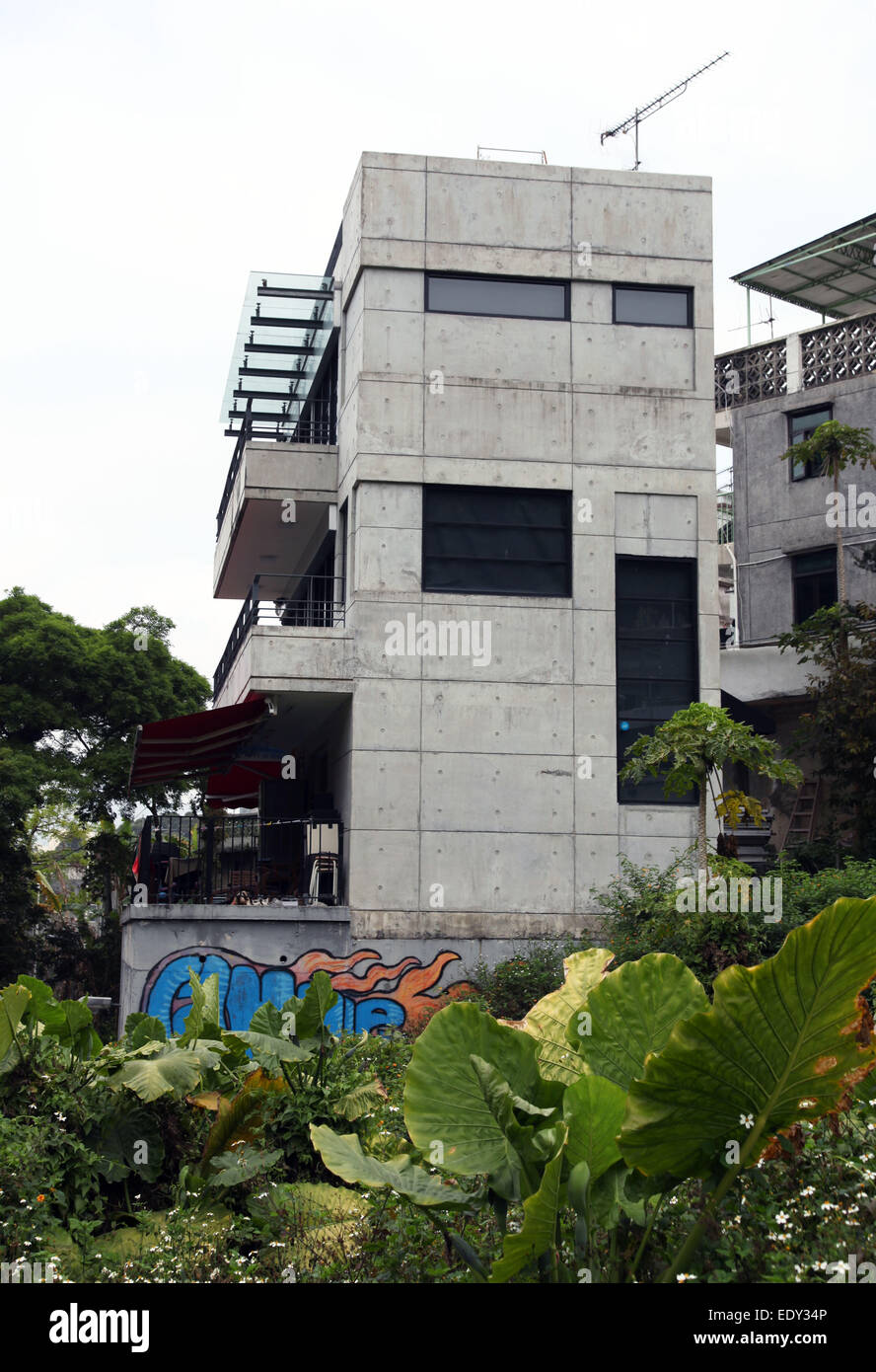 It's a photo of a brand new house in concrete that already has graffiti. It's in a village in Hong Kong Stock Photo
