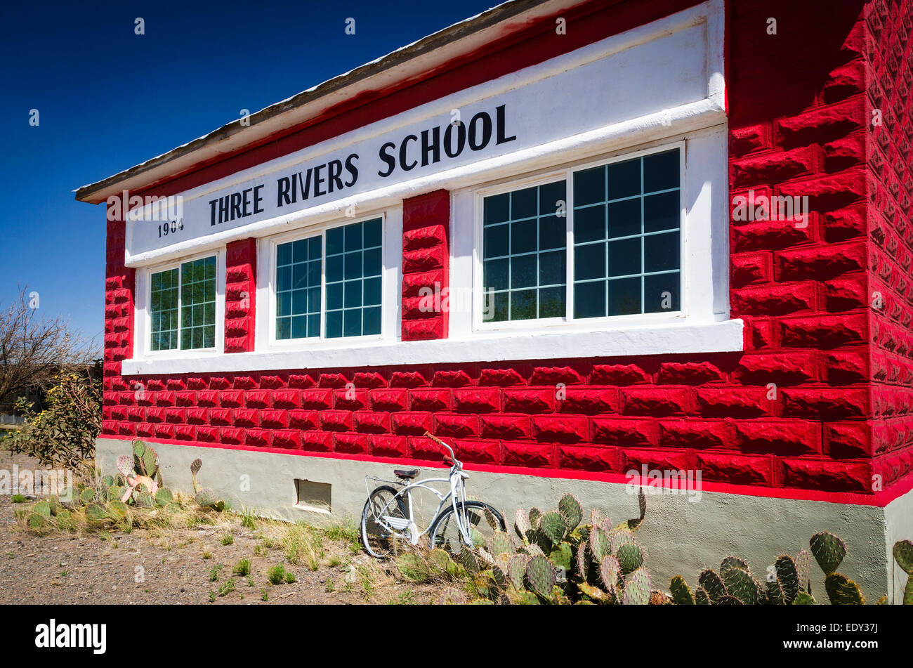 The historic red brick Three Rivers Schoolhouse, Three Rivers, New Mexico USA Stock Photo