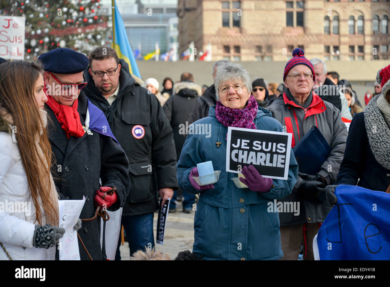 Toronto, Ontario, Canada. 11th January, 2015. Hundreds of Torontonians converged on Nathan Philips Square on Sunday afternoon to add their voices to a network of simultaneous demonstrations going on in major cities across Canada and around the globe to remember the victims of last week’s extremist violence in Paris. Credit:  Nisarg Lakhmani/Alamy Live News Stock Photo