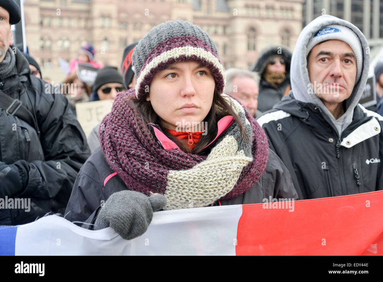 Toronto, Ontario, Canada. 11th January, 2015. Hundreds of Torontonians converged on Nathan Philips Square on Sunday afternoon to add their voices to a network of simultaneous demonstrations going on in major cities across Canada and around the globe to remember the victims of last week’s extremist violence in Paris. Credit:  Nisarg Lakhmani/Alamy Live News Stock Photo