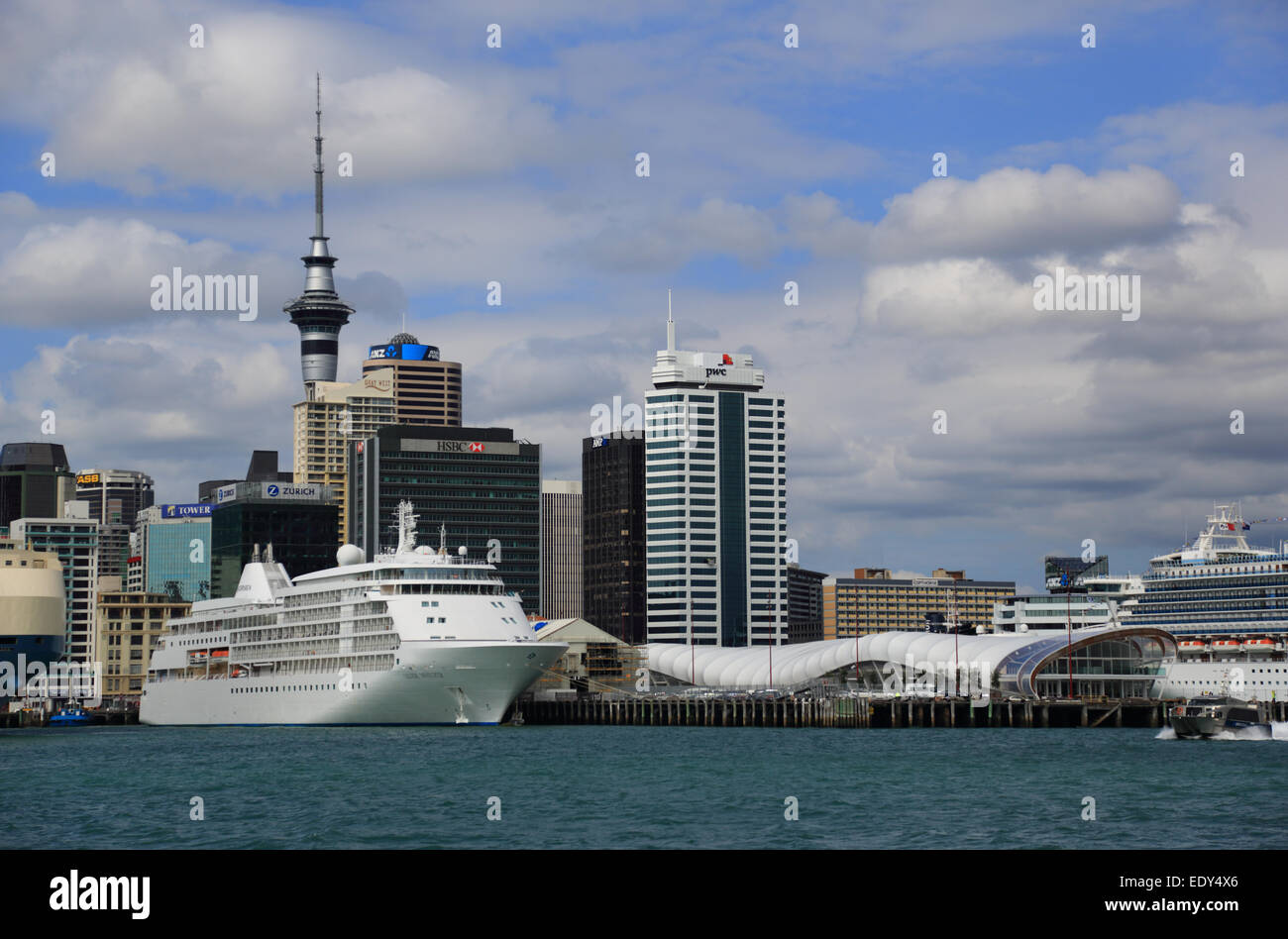 Auckland Port and skyline, Diamond Princess cruise ship and other shipping from Devenport Ferry, New Zealand Stock Photo