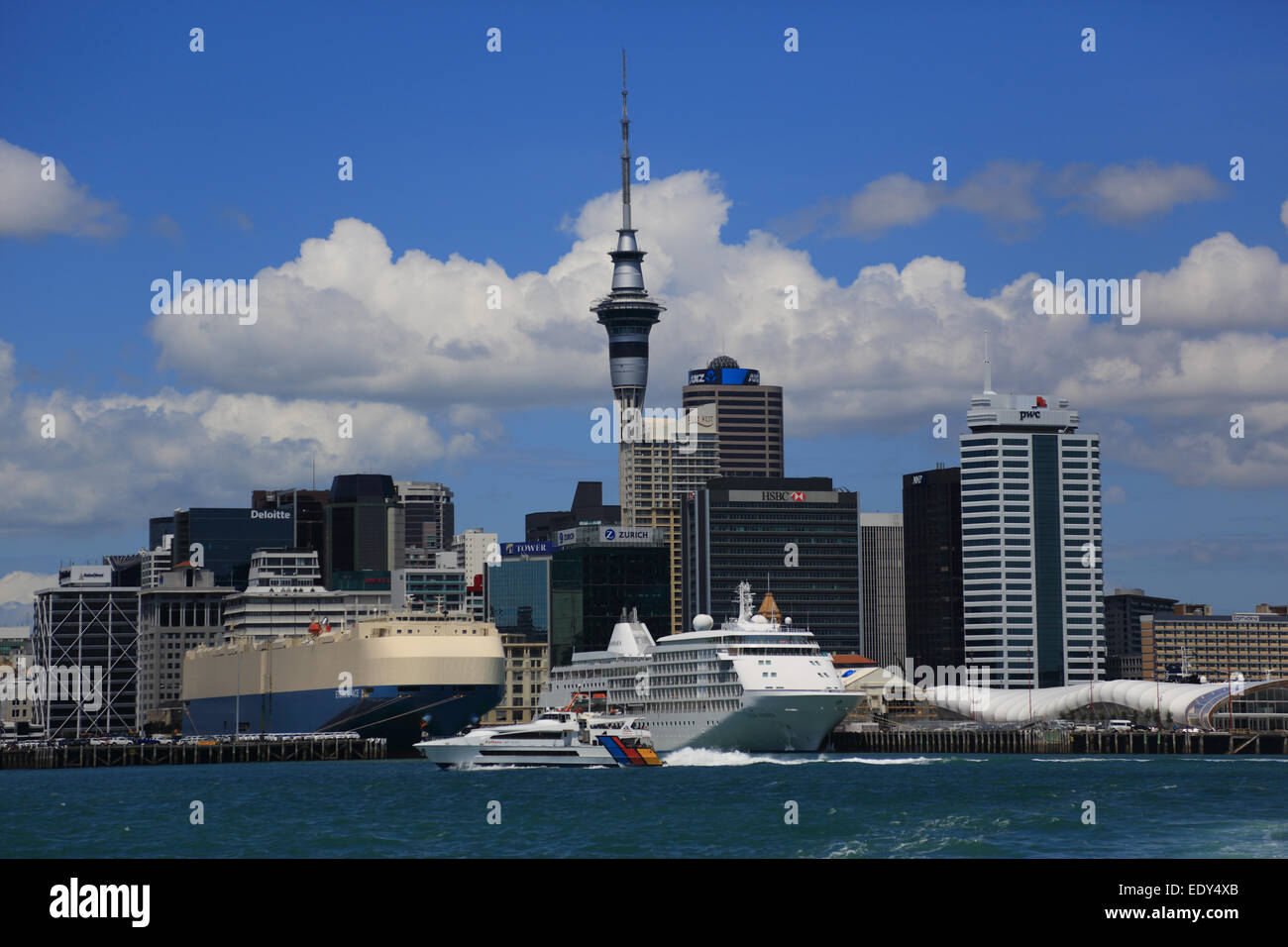 Auckland Port and skyline with fast boat, Diamond Princess cruise ship and other shipping from Devenport Ferry, New Zealand Stock Photo