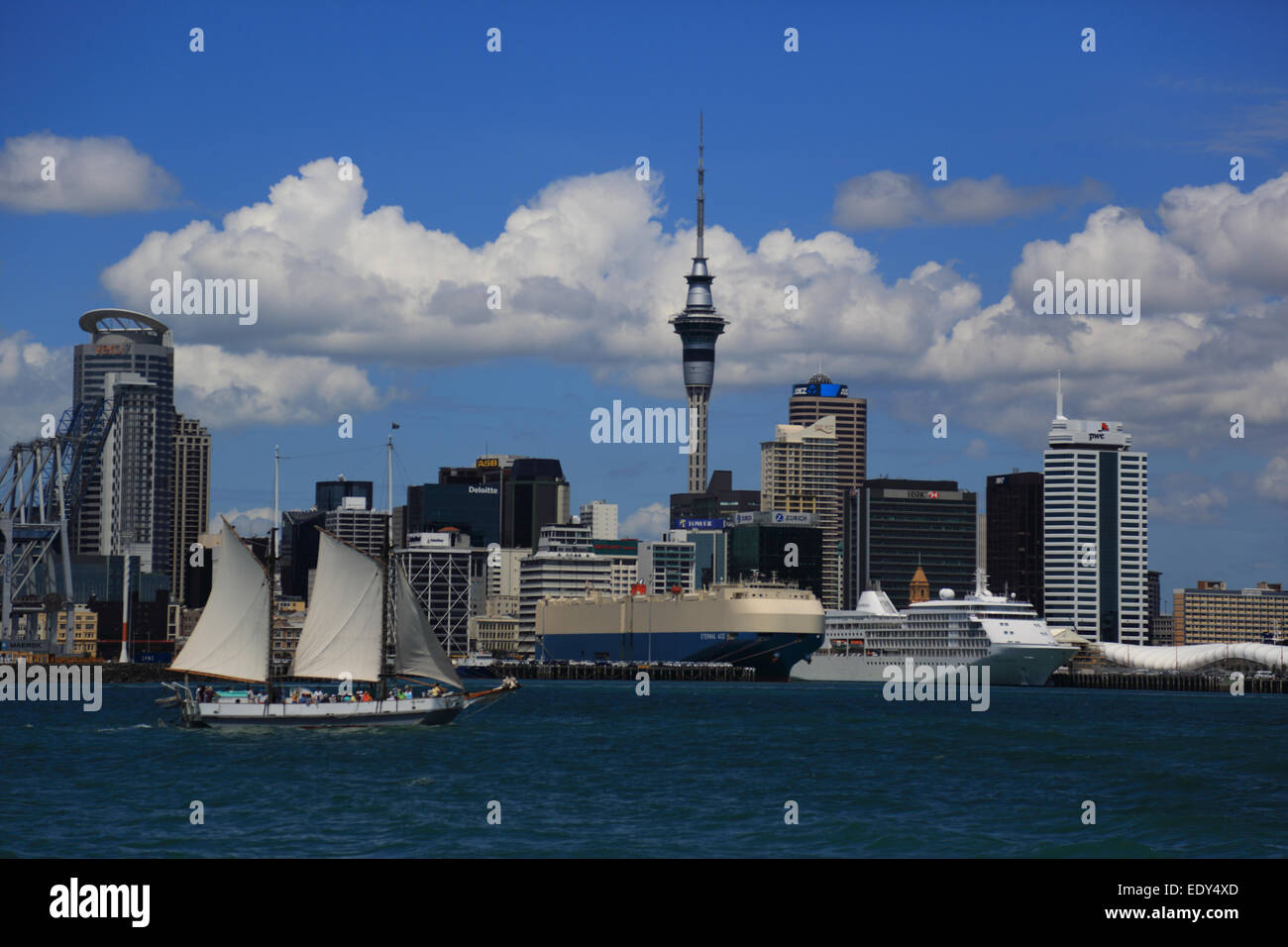 Auckland Port and skyline with sail boat, Diamond Princess cruise ship and other shipping from Devenport Ferry, New Zealand Stock Photo