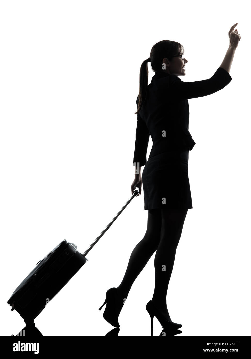 one business woman traveler walking hailing silhouette studio isolated on white background Stock Photo