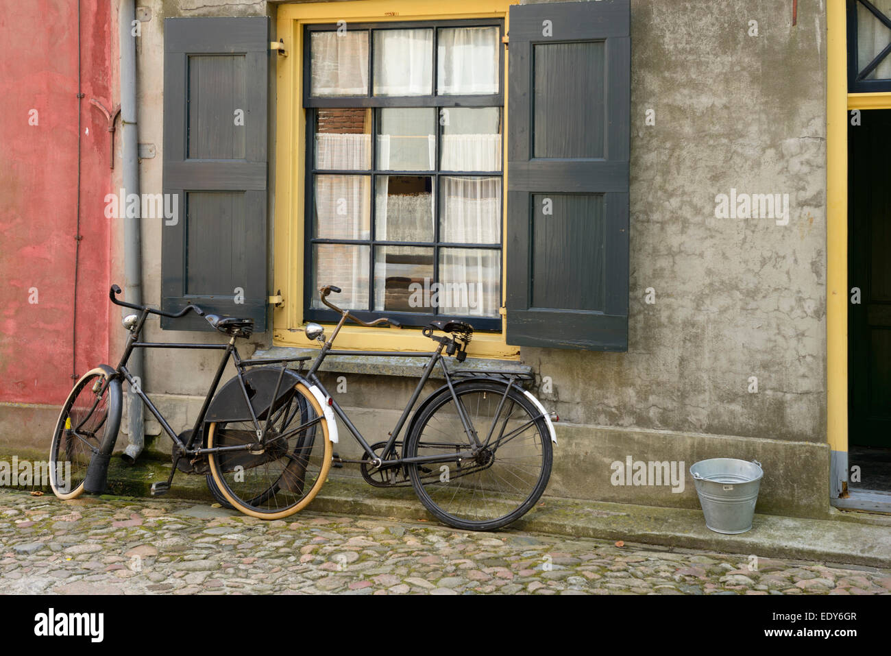 Traditional bicycles outside a building, Zuiderzee open air museum, Lake Ijssel, Enkhuizen, North Holland, Netherlands, Europe Stock Photo