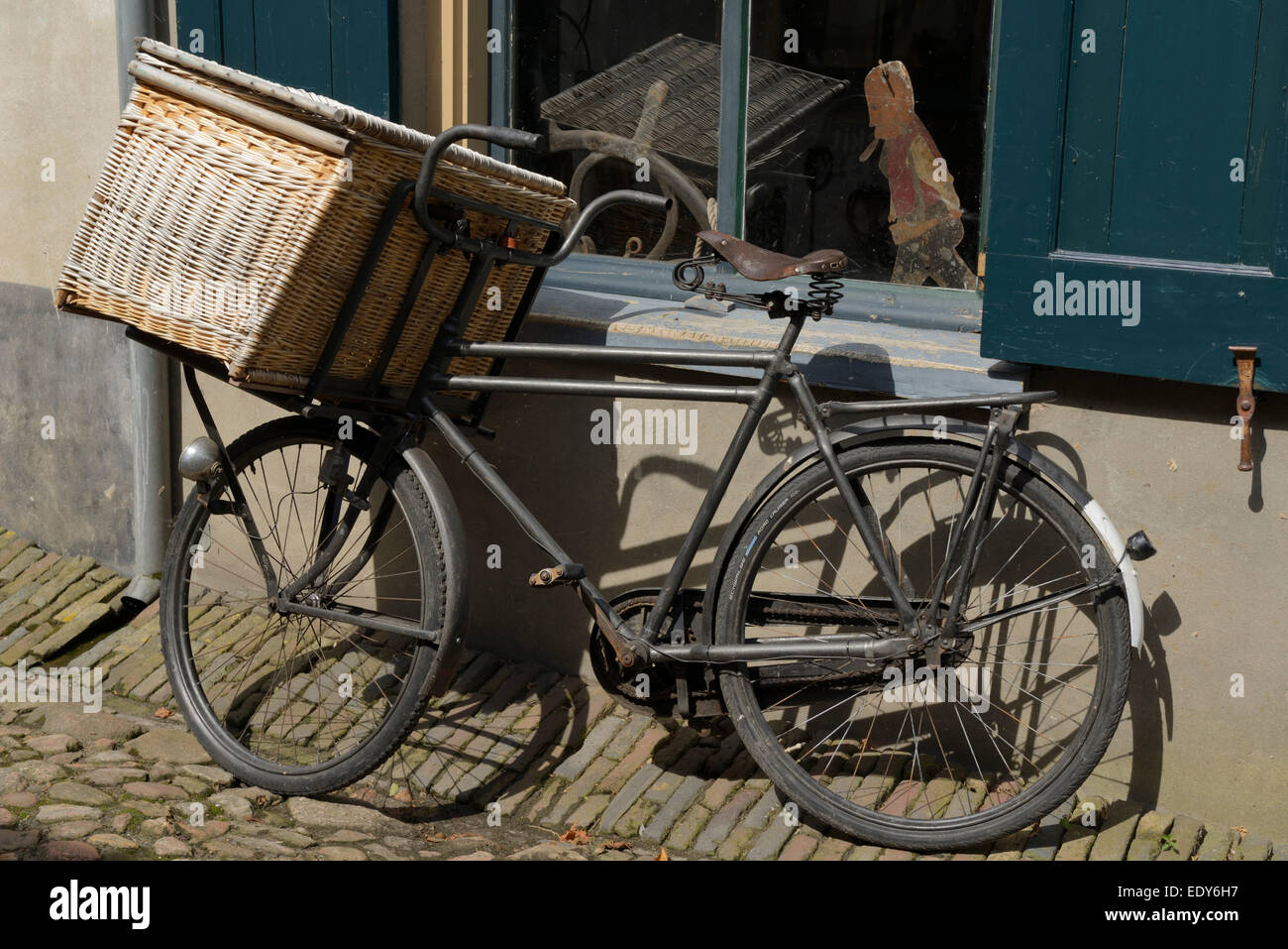 Traditional bicycle outside a buildings, Zuiderzee open air museum, Lake Ijssel, Enkhuizen, North Holland, Netherlands, Europe Stock Photo