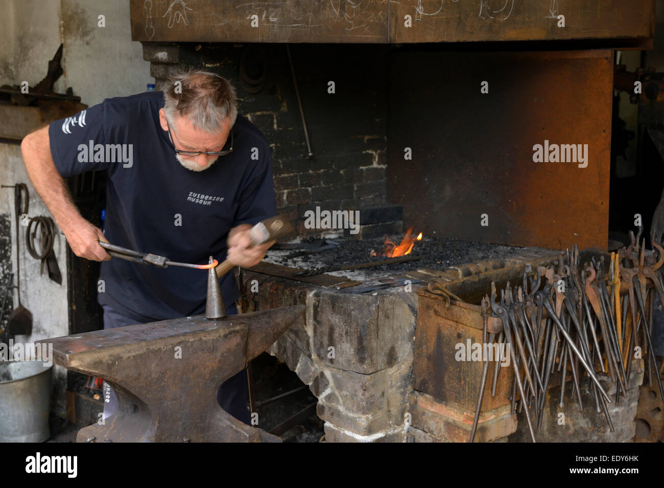 Blacksmith demonstration, Zuiderzee open air museum, Lake Ijssel, Enkhuizen, North Holland, Netherlands, Europe Stock Photo