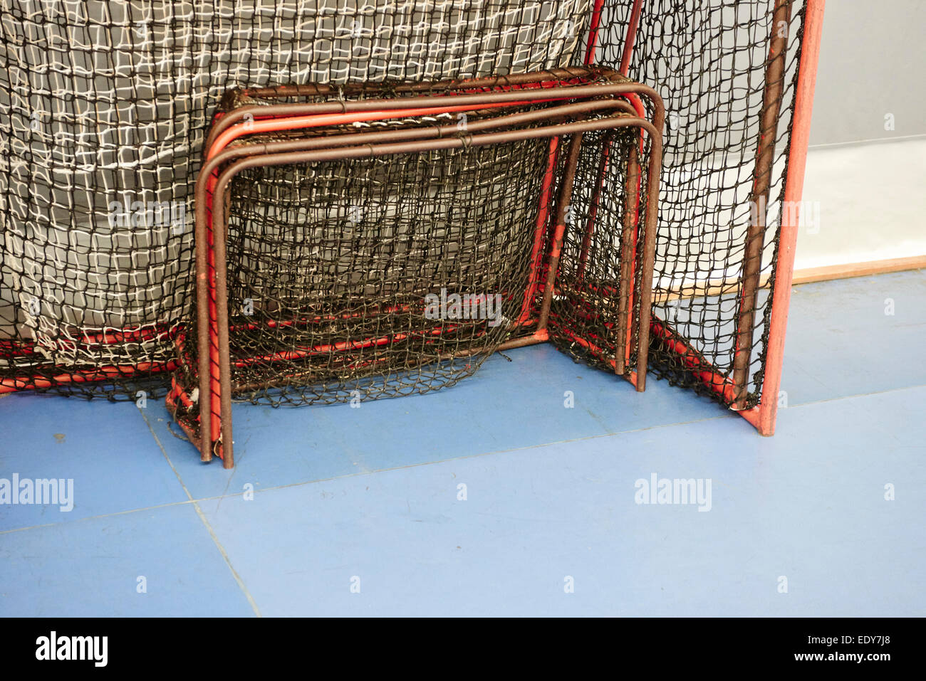 Children boys schoolchildren playing floorball (floor hockey) match in