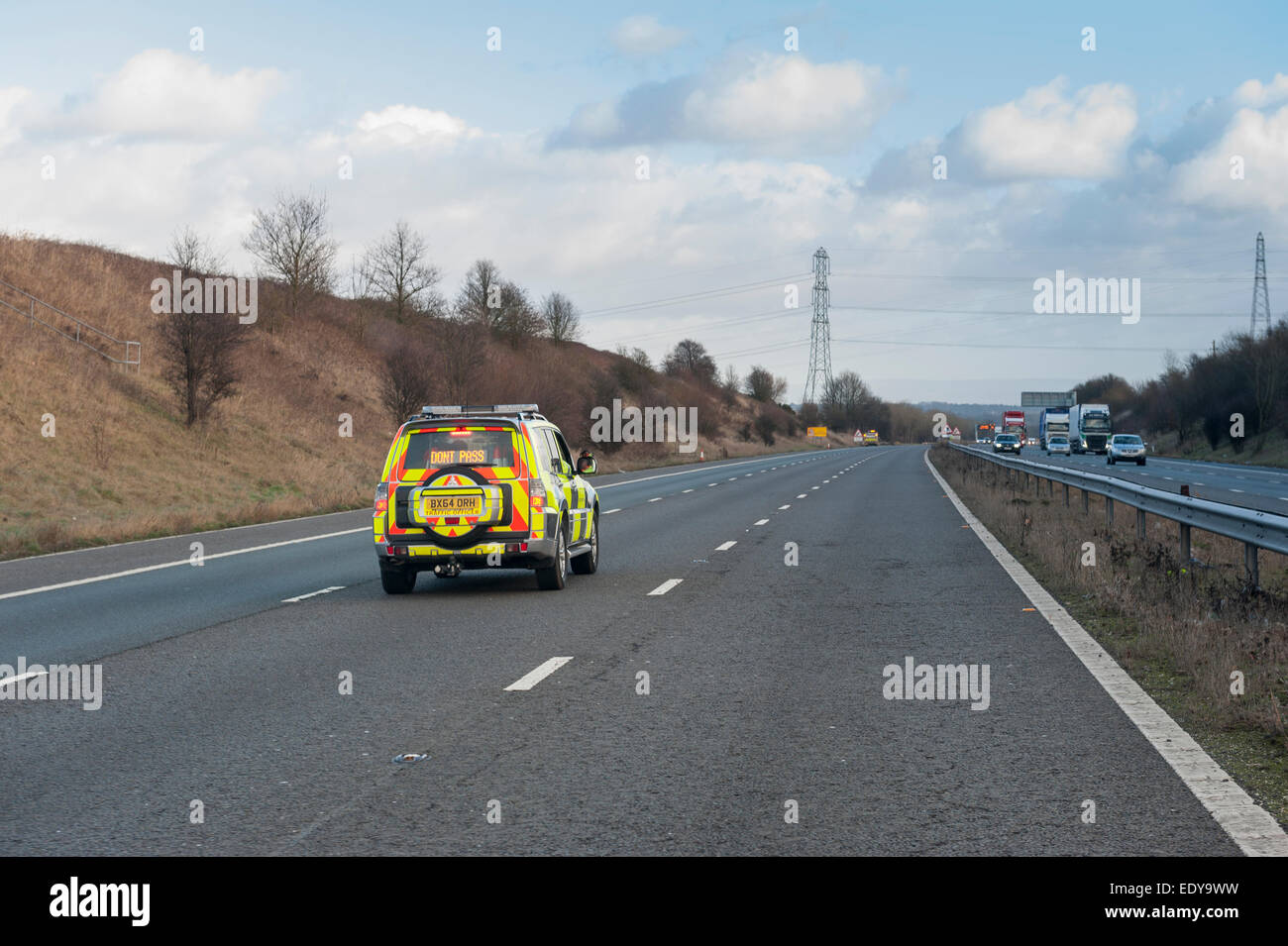 Traffic Officer Holding Traffic for an incident on the M56 in Cheshire Stock Photo