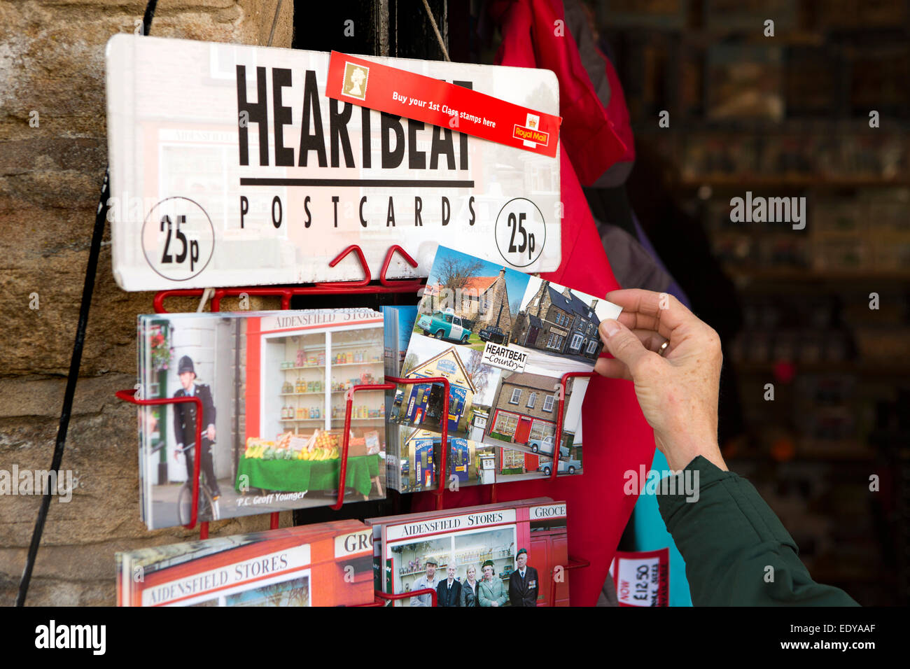 UK, England, Yorkshire, Goathland, Heartbeat memorabilia postcards on sale in village shops Stock Photo