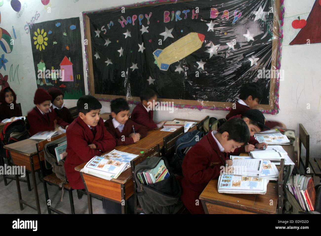 Peshawar. 12th Jan, 2015. Pakistani students attend class at a school in northwest Pakistan's Peshawar, Jan. 12, 2015. Schools in Pakistan's northwestern city of Peshawar reopened on Monday after a Taliban raid massacred 150 people, mainly children. © Ahmad Sidique/Xinhua/Alamy Live News Stock Photo