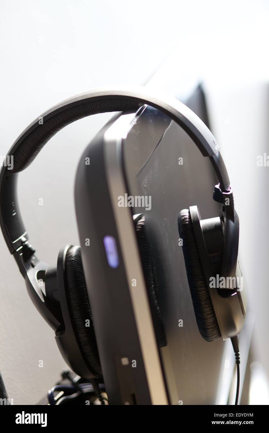 Close up shot of headphones on computer screen hi res stock
