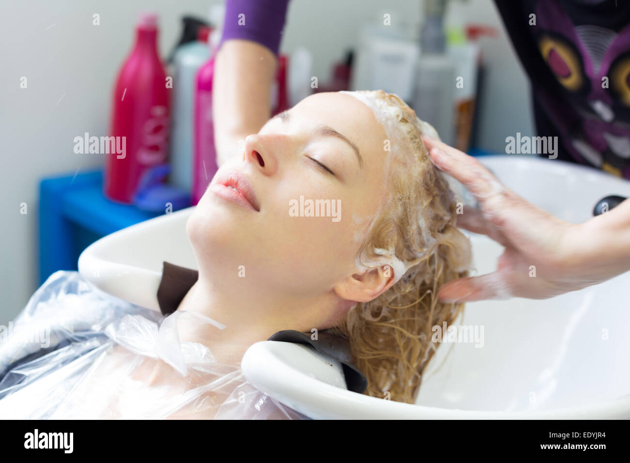 Hairdresser salon. Woman during hair wash. Stock Photo