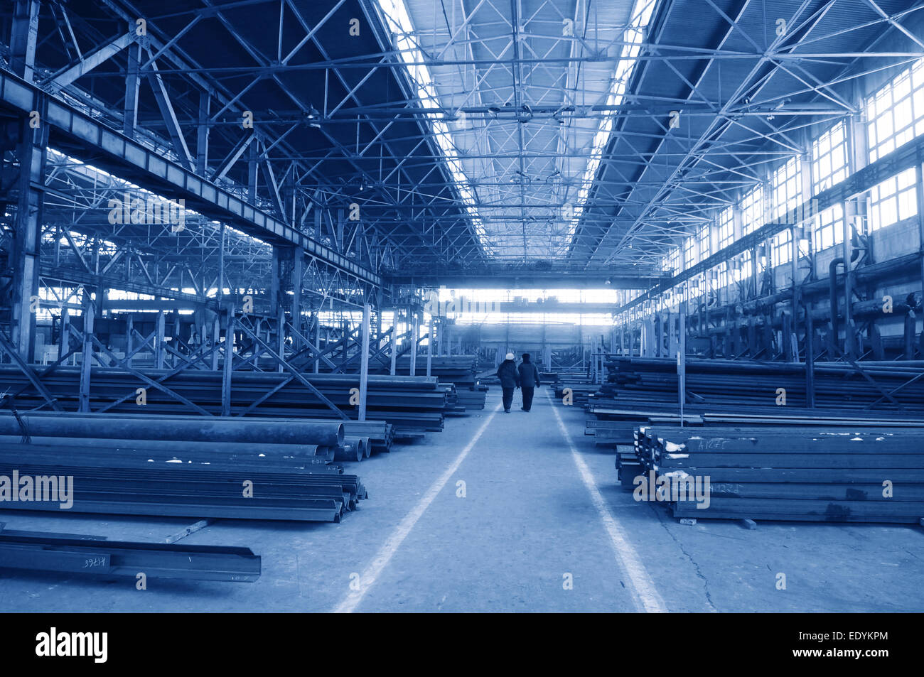 Rambling shop floor is made as steel construction. This production department make a specialty out of metalworks manufacturing. Stock Photo